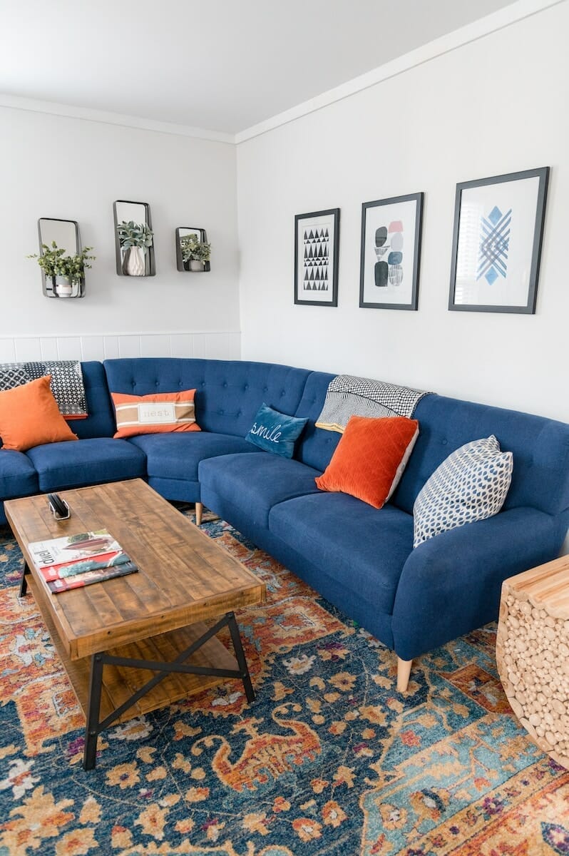 brown wooden coffee table beside blue couch